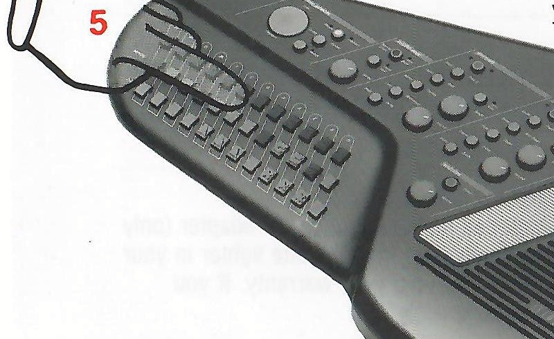 Hand pressing an OM-200m chord button for one-finger chord play.