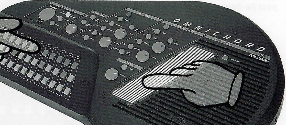 Hands selecting a chord and strumming the SonicStrings Strumplate, with the original safety callout.