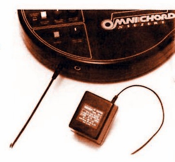 OCA mains adapter connected to an OM-27.