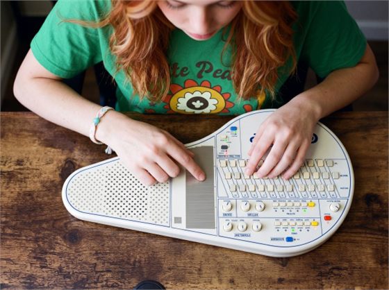 Overhead view of Aisling playing a Suzuki Omnichord OM-108